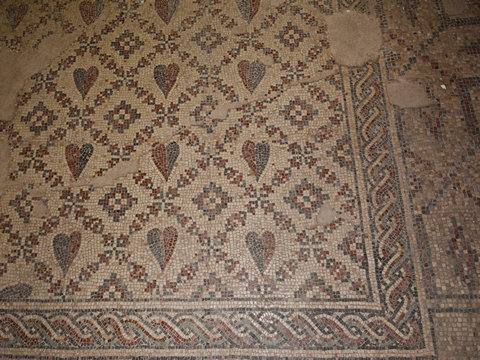 Green and red hearts in the mosaic of the Shalom al Israel Synagogue in Jericho